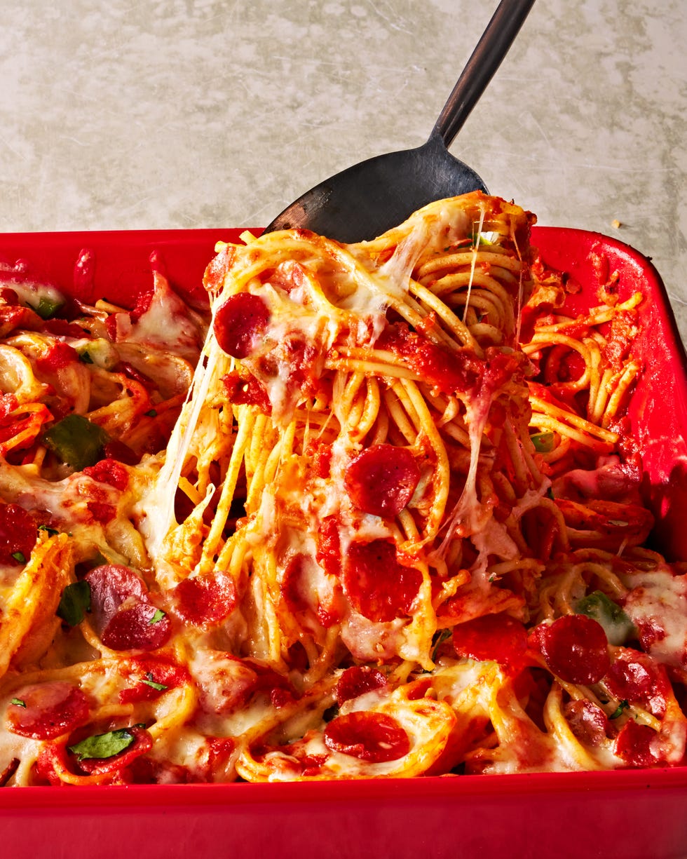 pizza spaghetti with cheese and pepperoni in a baking dish
