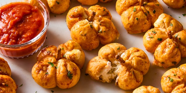 mini pumpkins made out of pizza dough stuffed with cheese