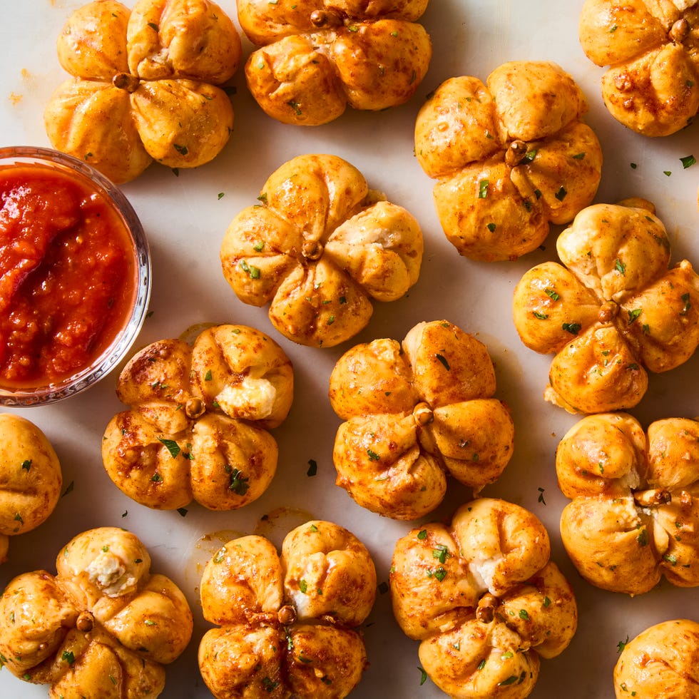 mini pumpkins made out of pizza dough stuffed with cheese