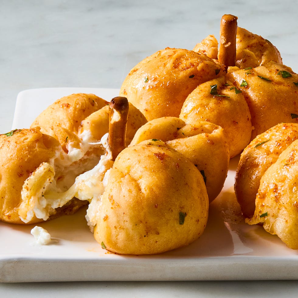 mini pumpkins made out of pizza dough stuffed with cheese