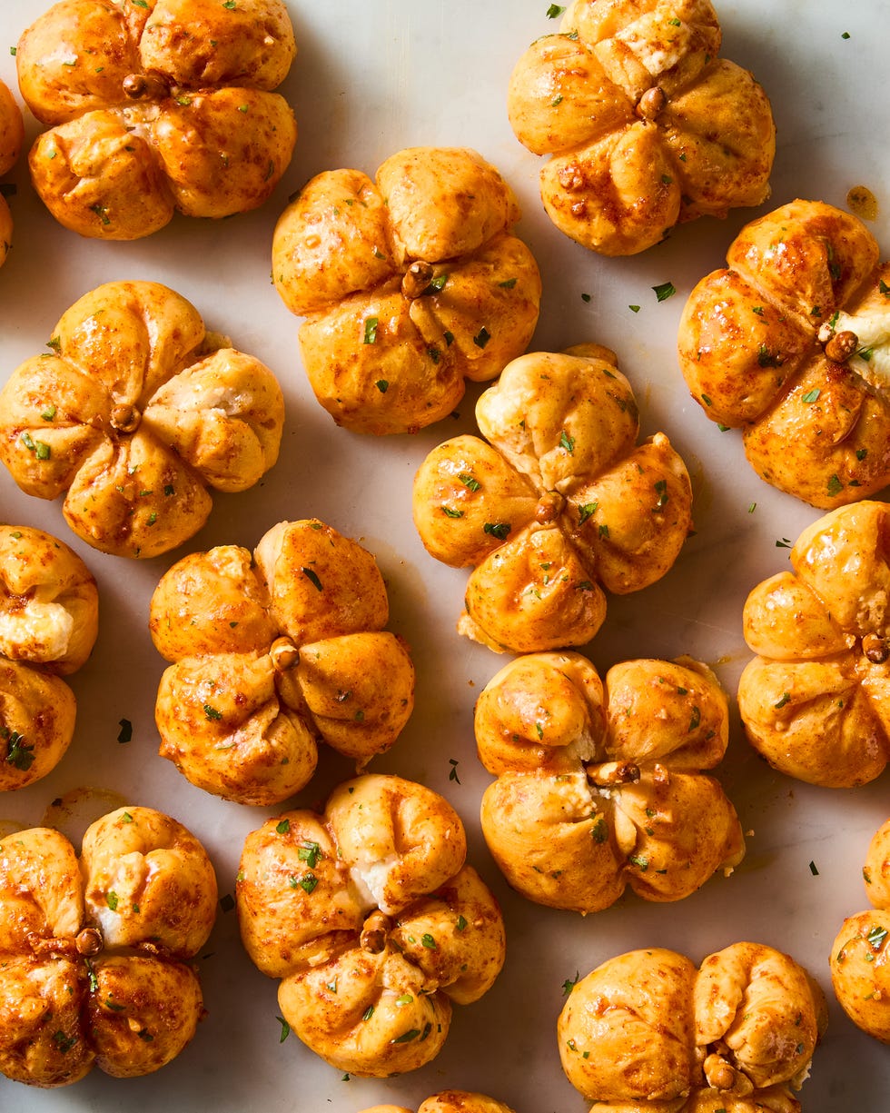 mini pumpkins made out of pizza dough stuffed with cheese