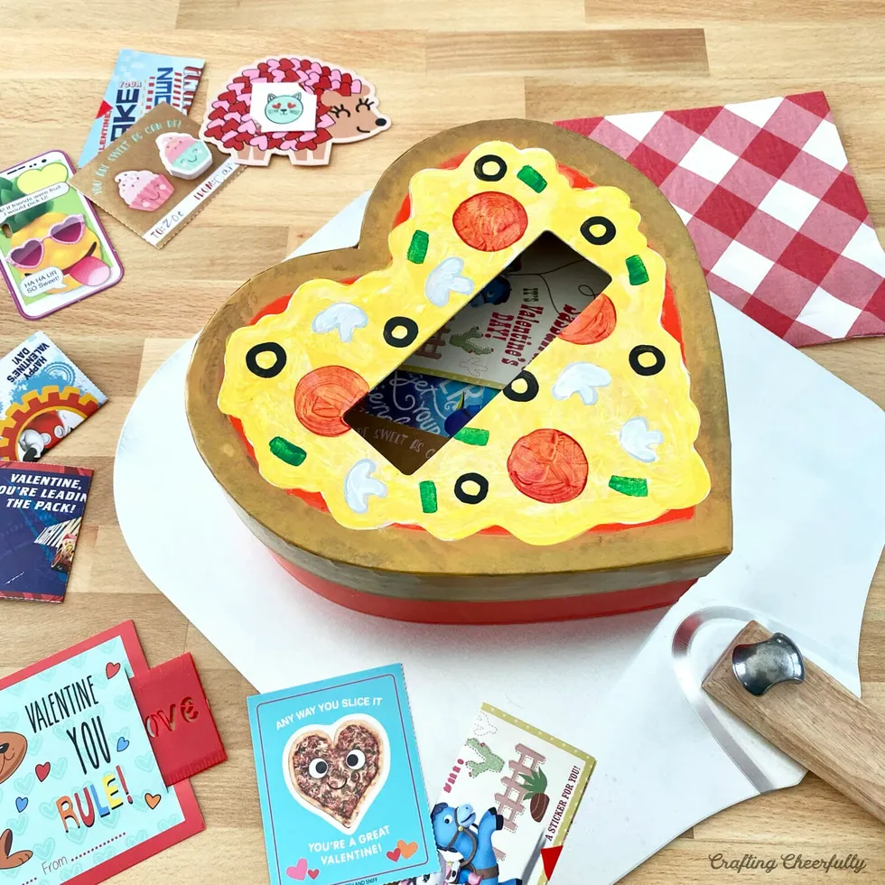 heartshaped pizza box filled with valentines day cards