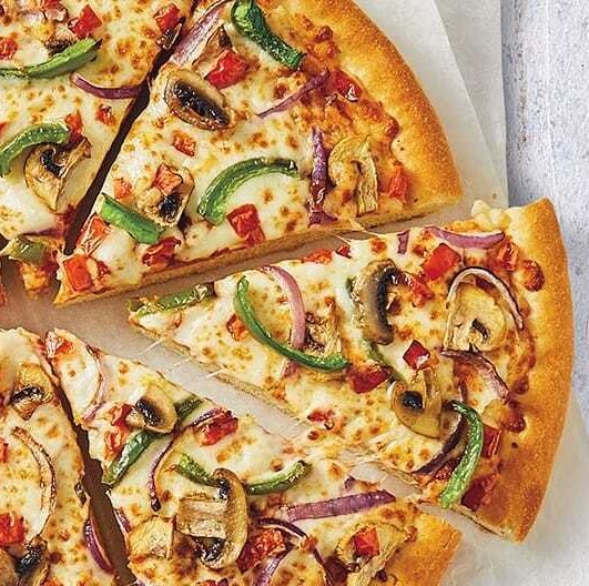 a pizza with mushrooms and peppers