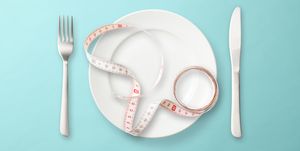 place setting with measuring tape on light blue background