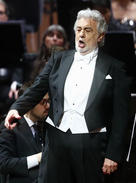 placido domingo wearing a tuxedo and singing
