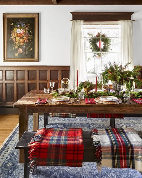 table set for christmas dinner with plaid blankets