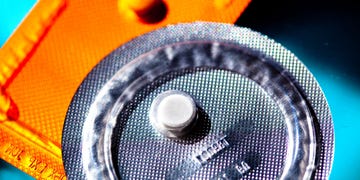 Light, Orange, Yellow, Audio equipment, Circle, Macro photography, Photography, Auto part, Automotive lighting, Metal, 