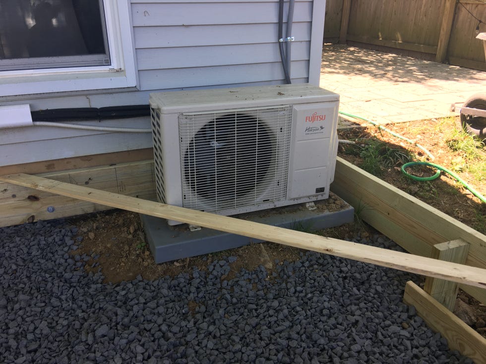 a white microwave on a wooden pallet