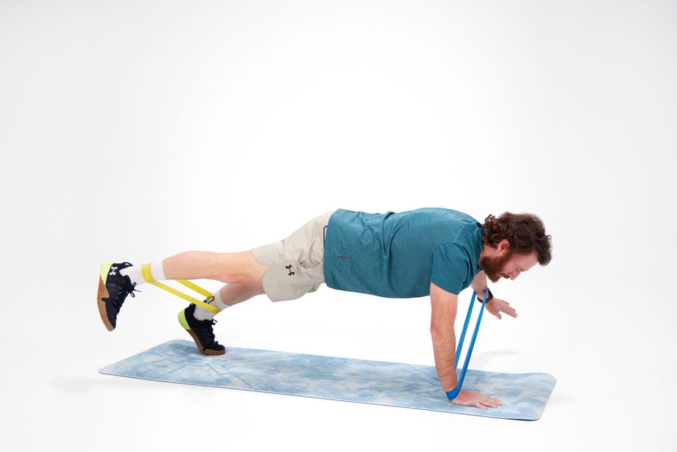 a man doing a plank on a mat