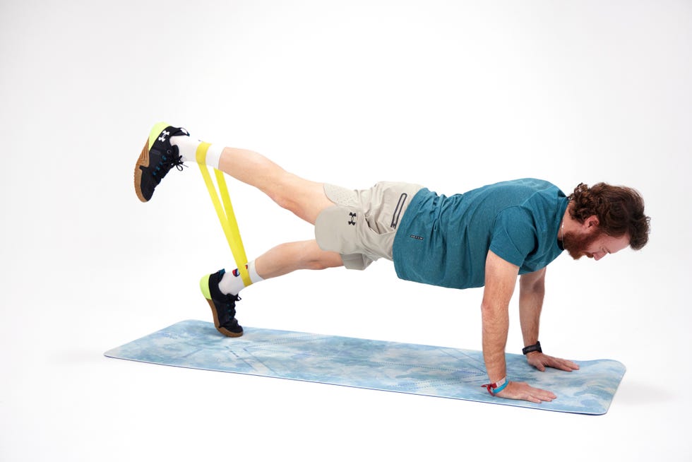 a man doing a plank on a mat