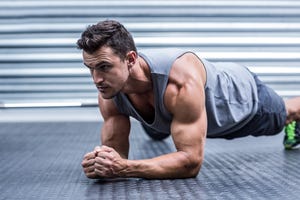 A muscular man on plank position