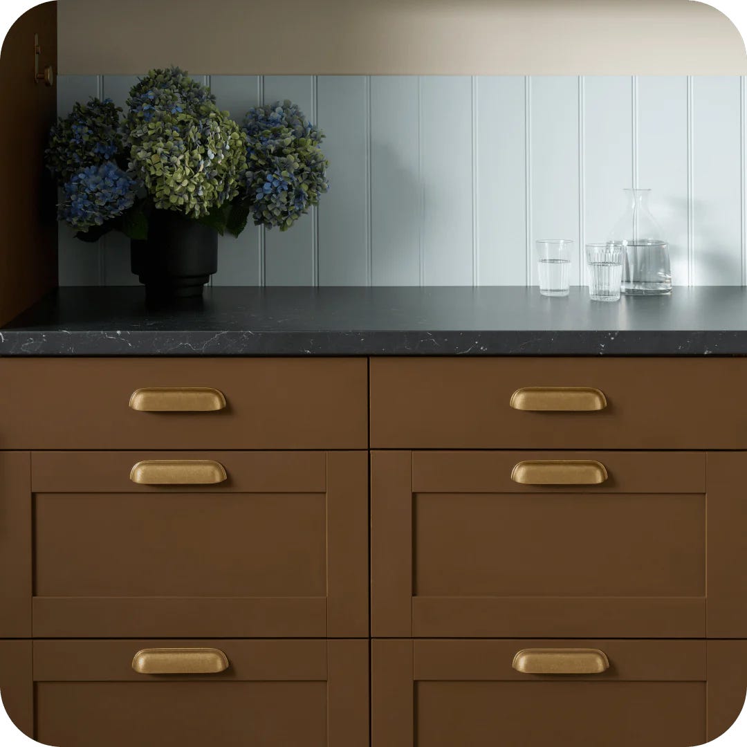 a kitchen counter with potted plants
