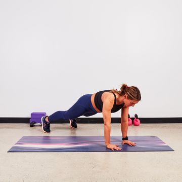 woman doing a plank, engaging core
