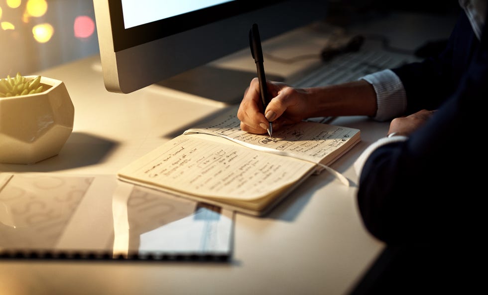woman writing in journal