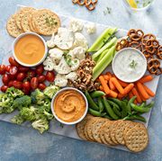 plant based snack board with vegetables and crackers