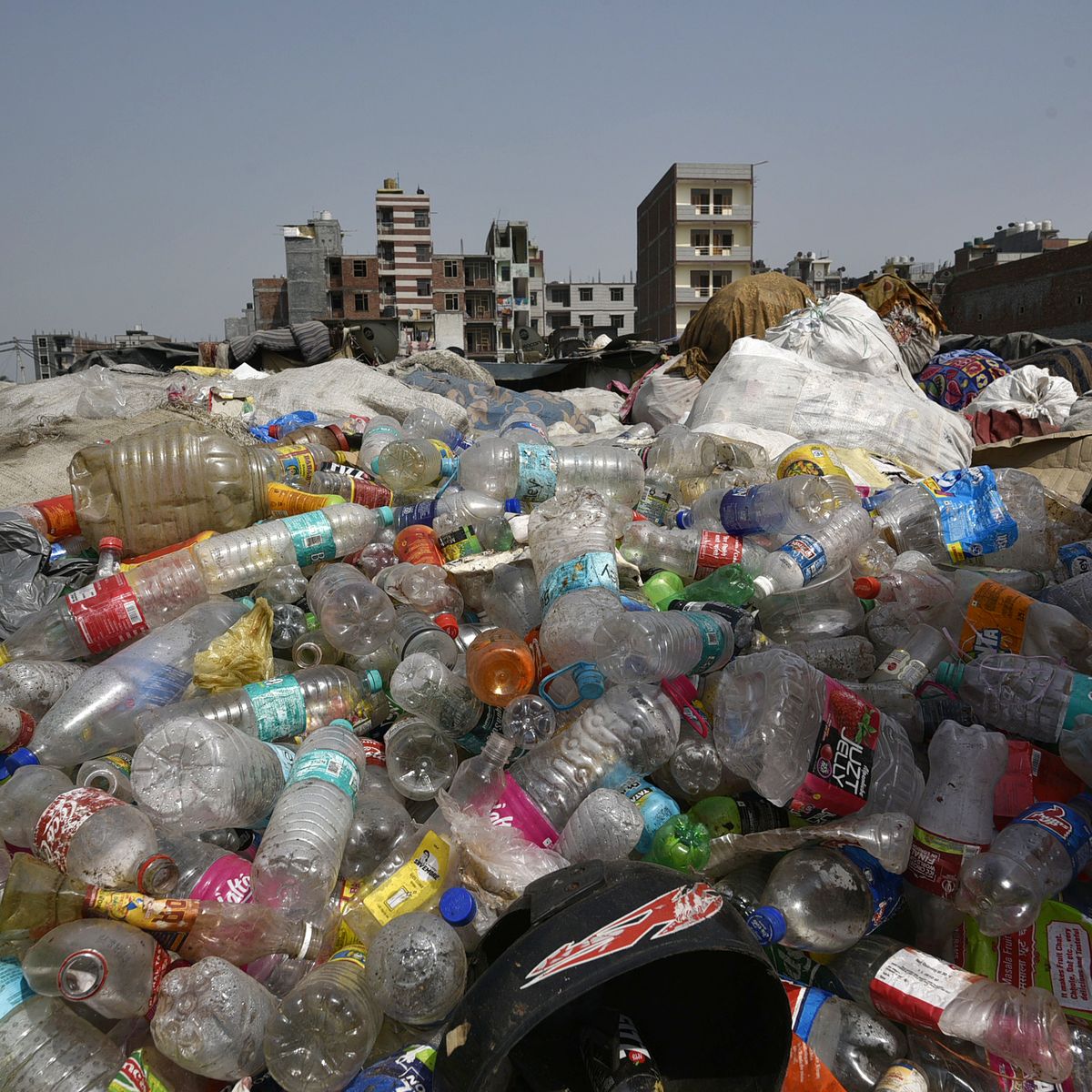 https://hips.hearstapps.com/hmg-prod/images/plastic-bottles-and-containers-are-seen-at-a-garbage-dump-news-photo-1148072242-1567621380.jpg?crop=0.66757xw:1xh;center,top&resize=1200:*
