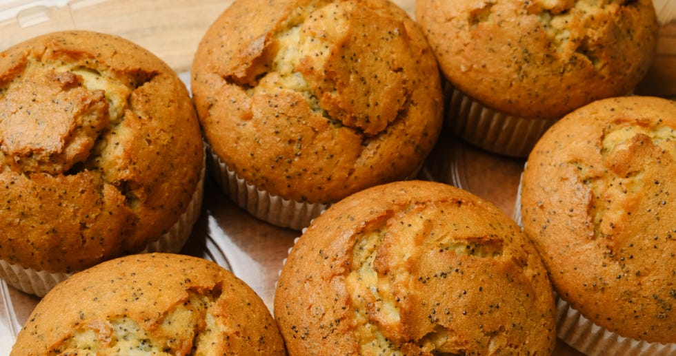 plastic tray of organic lemon and poppy seed muffins close up
