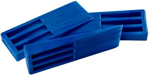Blue plastic molding wedges stacked on side view