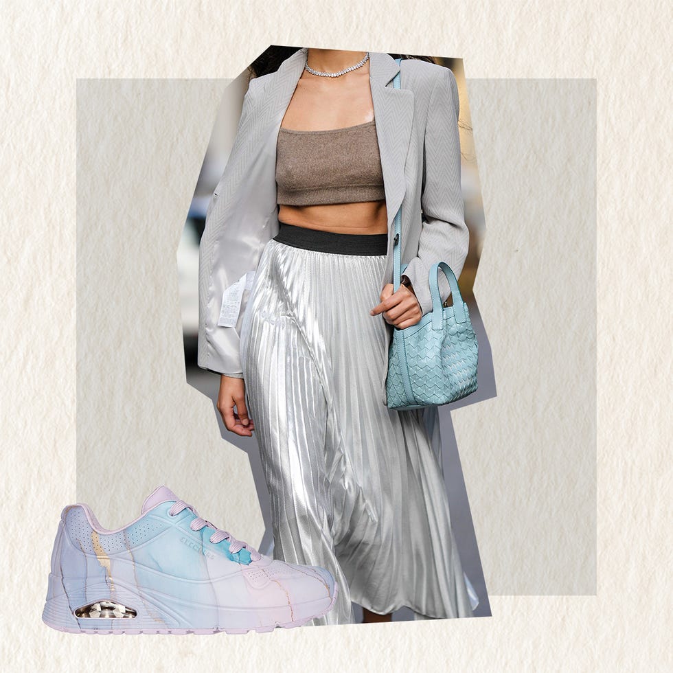 model showcasing a chic outfit with a metallic skirt cropped top and stylish accessories