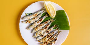 plate of freshly cooked grilled sardines