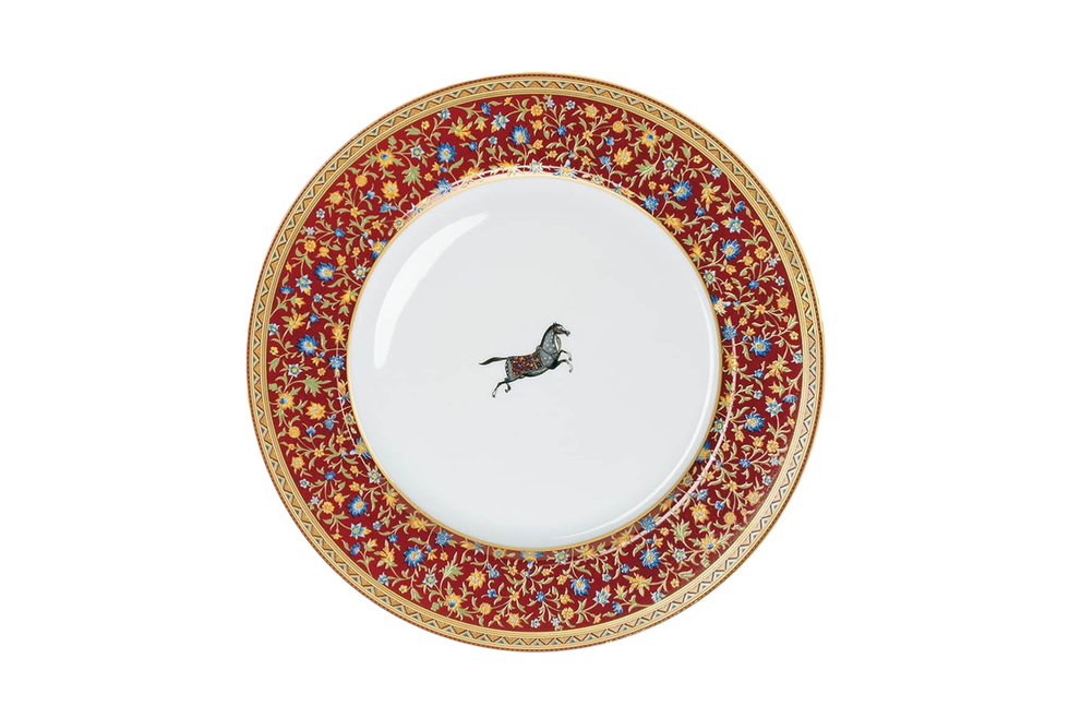 decorative plate featuring a central horse illustration and floral border