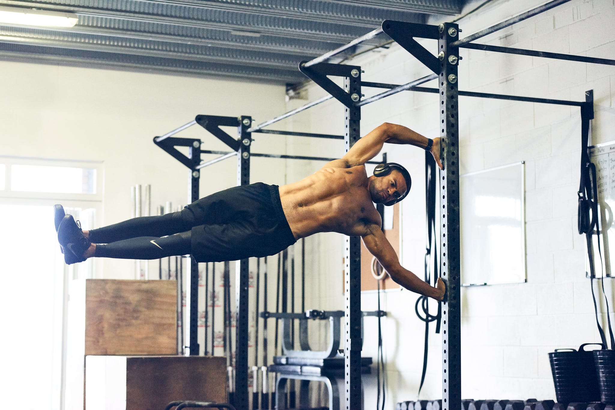 man working out wearing headphones