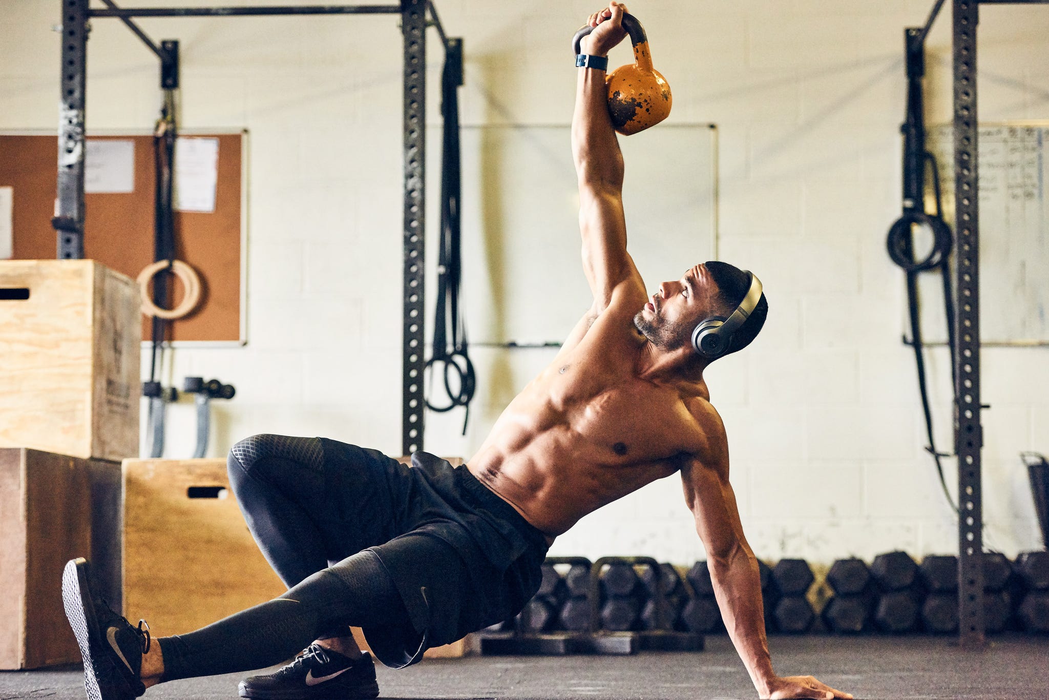 man working out wearing headphones