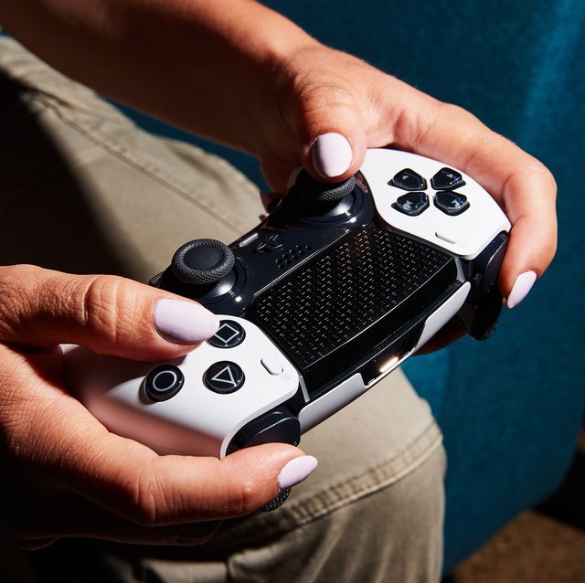 a person holding a game controller