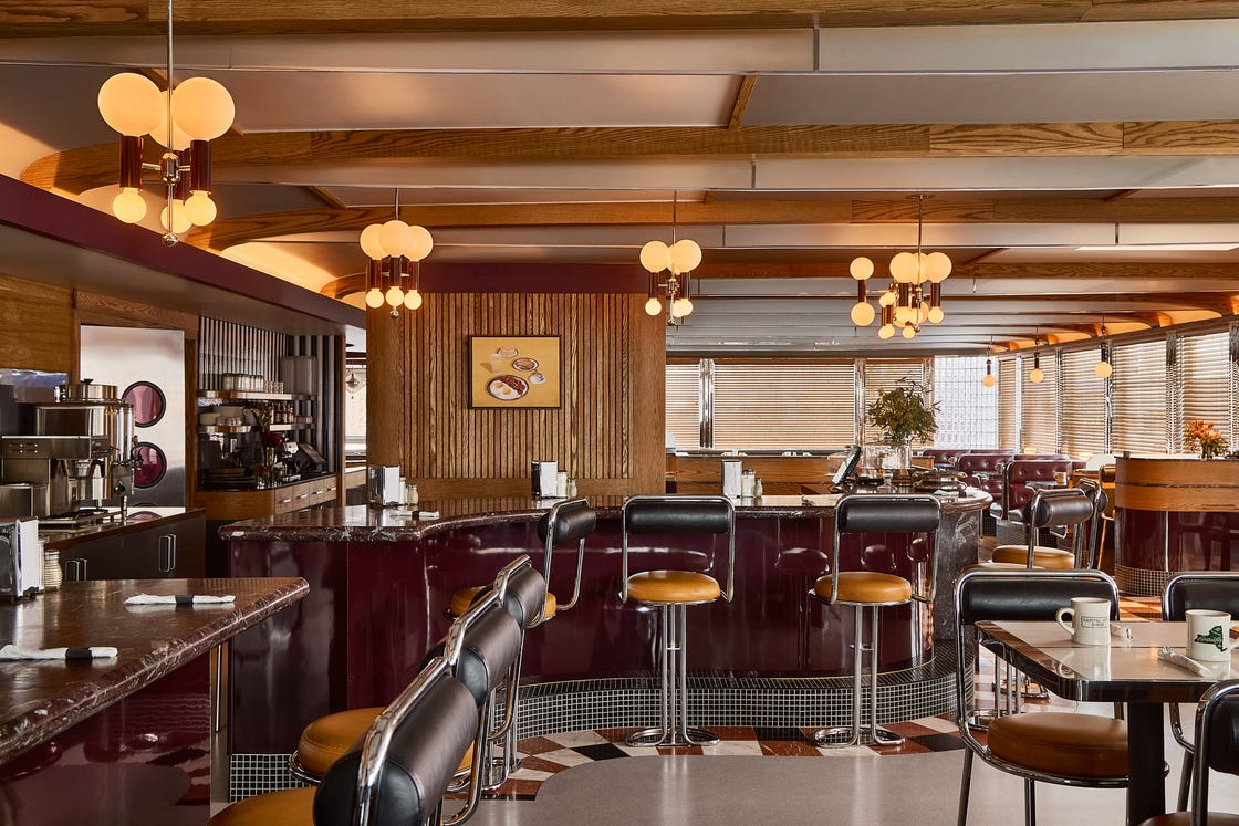 interior of a modern diner with a focus on seating and decor