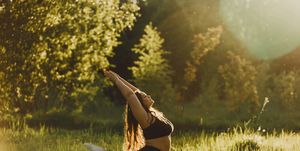 plus size girl doing yoga in nature