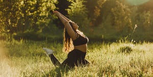 plus size girl doing yoga in nature