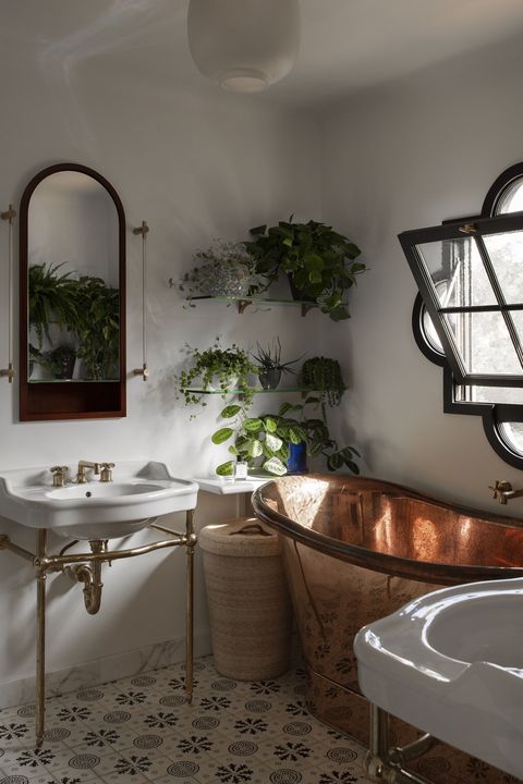 copper bath tub, white basin, plants