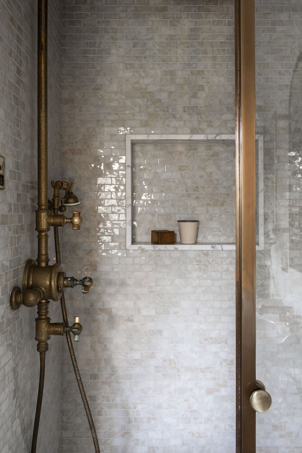 shower, white tiles, copper faucet and taps
