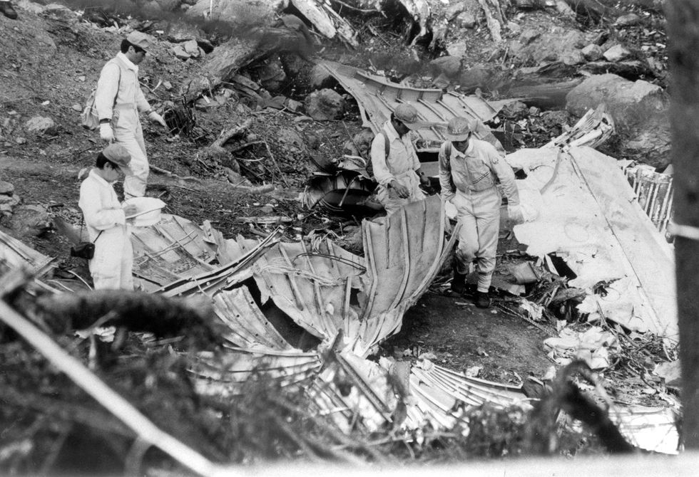 ueno, japan august 18 japan airlines staffs investigate the debris of the aft pressure bulkhead at the crash site at the ridge of mount osutaka on august 18, 1985 in ueno, gunma, japan japan airlines flight 123 from tokyo to osaka crashed into the ridge of mt osutaka, 520 passengers and crews were killed in the deadliest single aircraft accident, only four people survived photo by the asahi shimbun via getty images