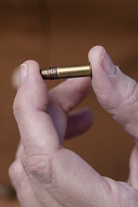 lynell morris holds a 22 bullet found by her husband, michael morris, on the front doormat of their house in murphy, nc october 14, 2022