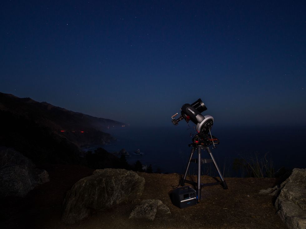 astrophotography equipment with the night sky behind it