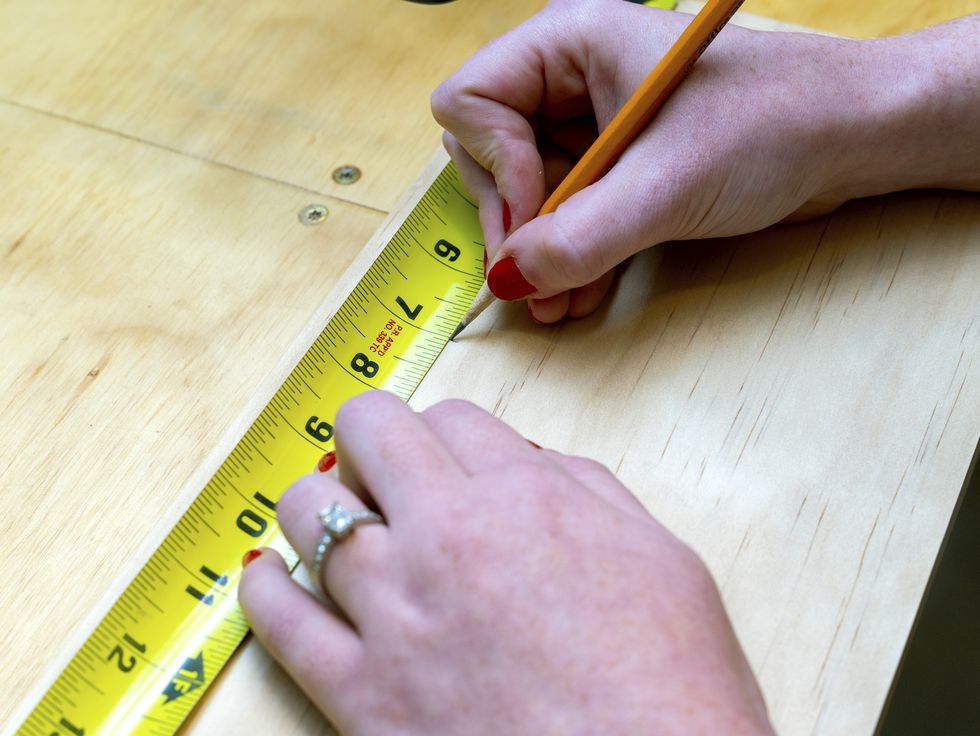 measuring tape and a womans hands