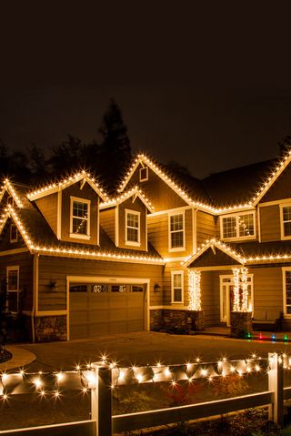portland house with christmas lights highlighting roof