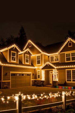 portland house with christmas lights highlighting roof