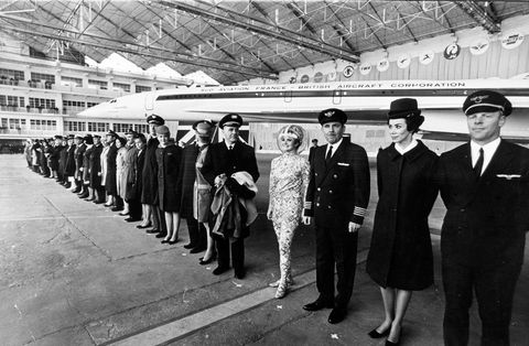 pilots and flight attendants stand in front of the concorde at the official rollout ceremony in toulouse france on december 11 1967