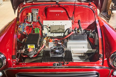 after pulling out the old engine and transmission and all the lines and hoses that those parts require, there was plenty of room under the morris minor’s hood for a couple of batteries more are in the rear and a small motor controller