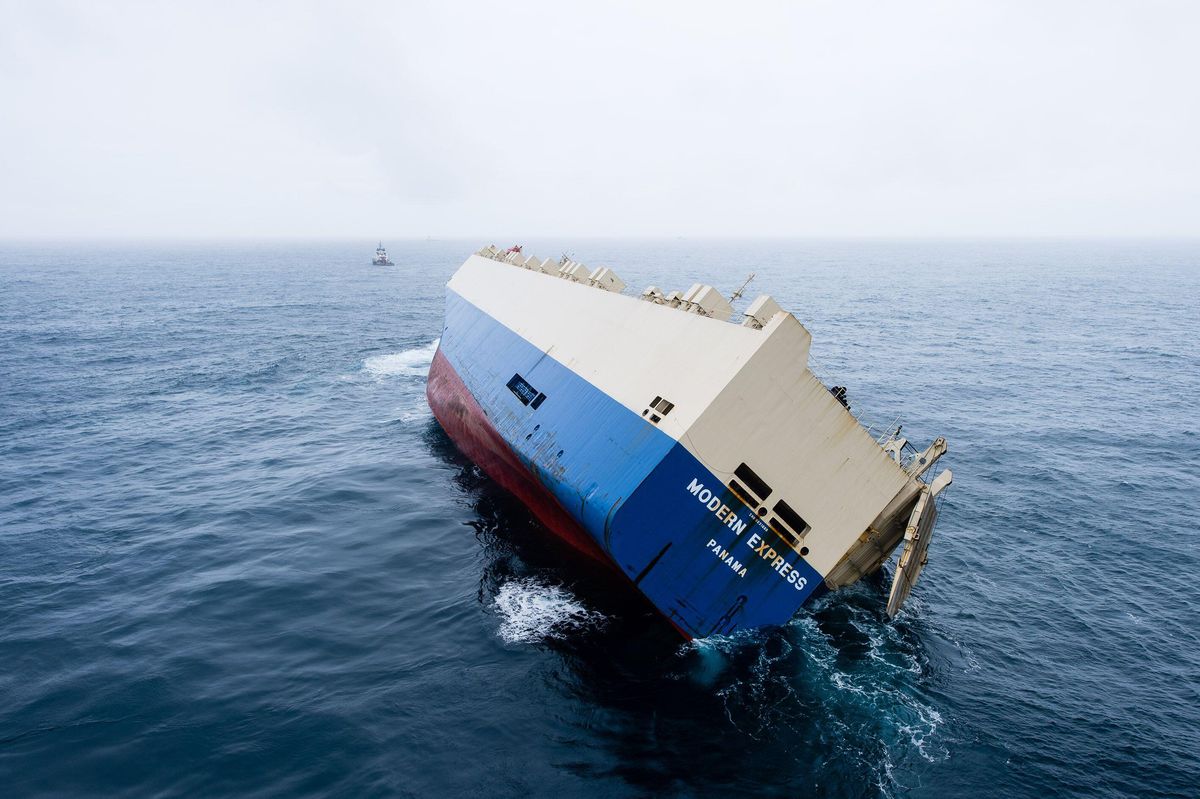 The <em>Modern Express</em>, is towed to sea in 2016, where it was salvaged after developing a 40-degree list off the coast of France.