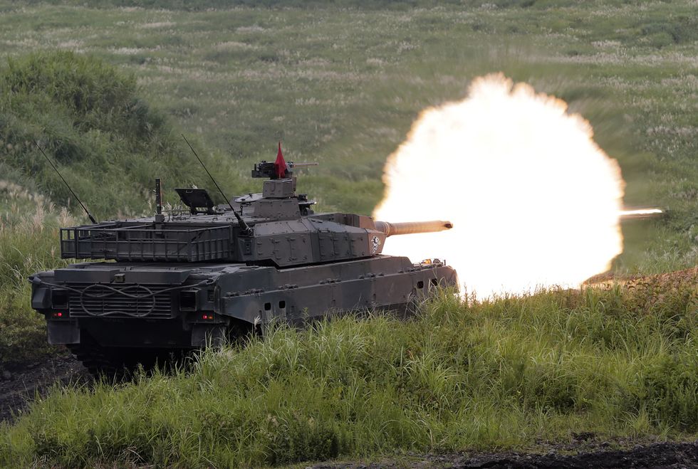 gotemba, japan   august 25  japan ground self defence force's type 10 armoured tank fires during the rehearsal for annual live firing exercise at the jgsdf's east fuji maneuver area on august 25, 2016 in gotemba, japan  photo by yuya shinogetty images