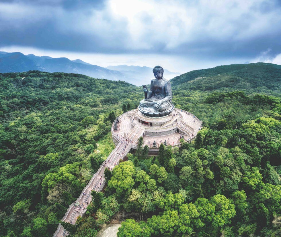 a statue on a hill