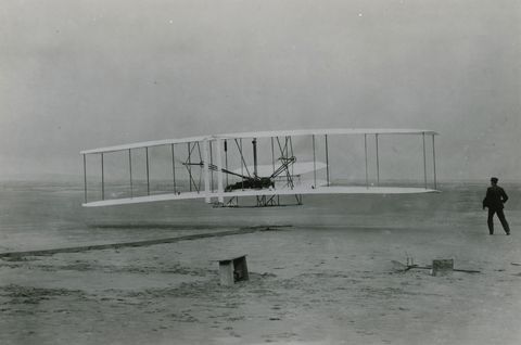 The Wright brothers made the first powered flight on this day in 1903 Orville mans the plane lying on his stomach to reduce wind resistance while Wilbur runs alongside The flight lasted 12 seconds and covered about 120 feet