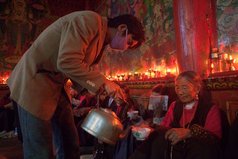 At a Tibetan monastery in Bamei China bowls of black tea keep visitors awake for meditations Behind them are candles made of yak butter