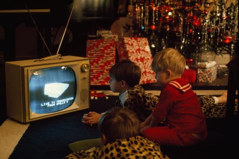 In this picture from the May 1969 issue children watch the Christmas Eve broadcast from Apollo 8 astronauts in space The crew was the first to successfully orbit the moon and return to Earth