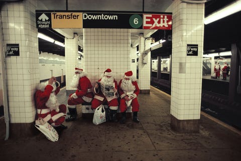 A group of department store Santas wait for the subway in New York City Getting a photo with Santa is a cherished tradition for many families