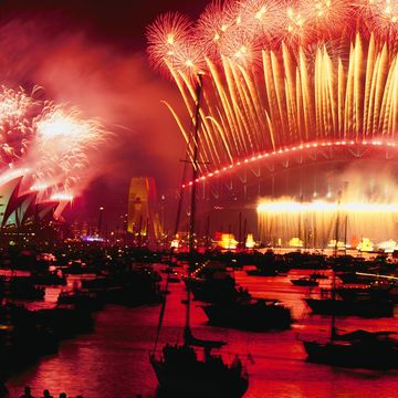 Twenty tons of fireworks explode over Sydney Harbour at midnight ringing in the year 2000 The cover story for the August 2000 issue celebrated the city as it hosted the Summer Olympics