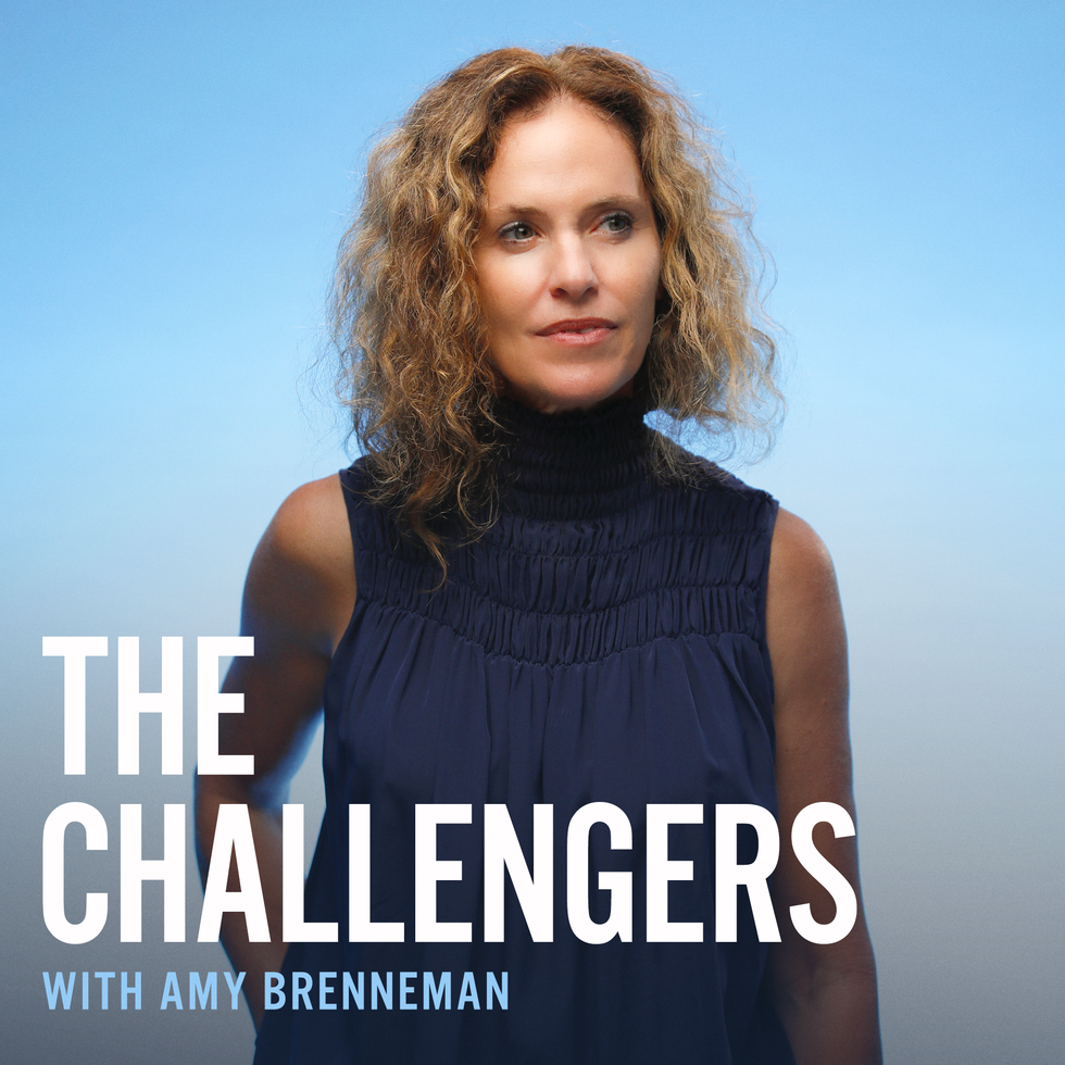 amy brenneman in a blue shirt on a blue background